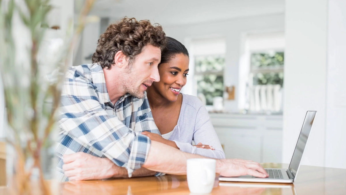 Couple looking at a computer
