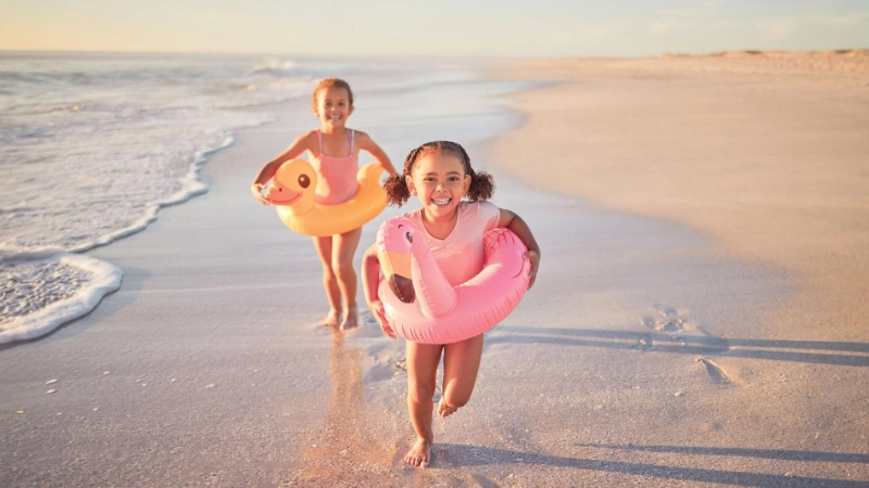 Kids running on the beach