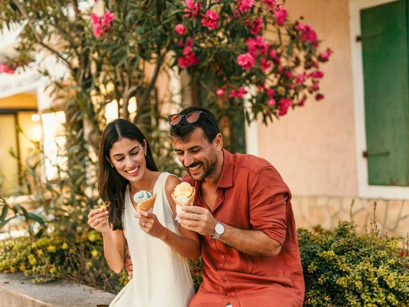 Young couple on vacation enjoying ice cream